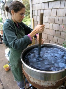 Stirring my young fermentation Indigo Vat in 2005- it was not yet ready to use.