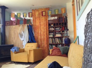 the midcentury sunflower yellow couch and chair that inspired the name Starlight Lounge.