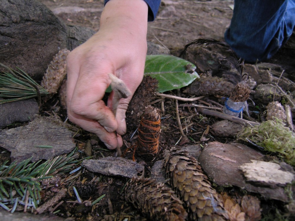 Sam making adjustment to pinecone village around 2007