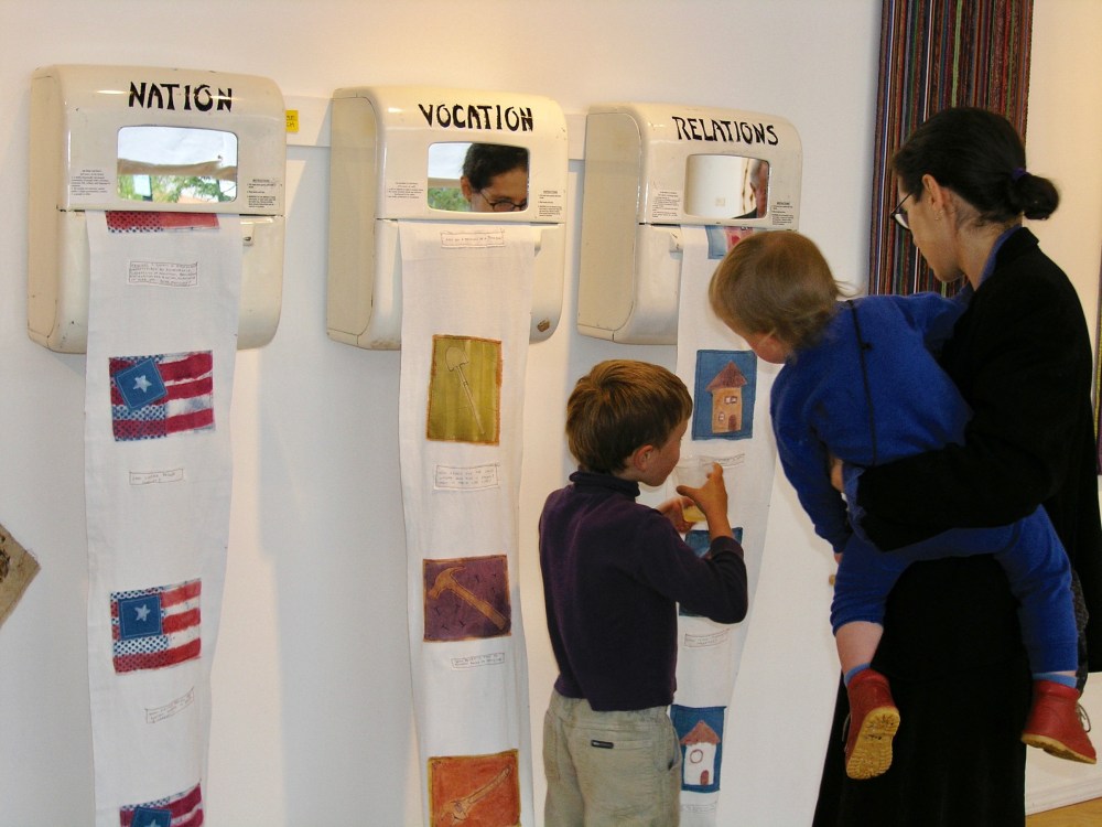 Checking out my installation with the boys June 2004. Each pull of the towel brought a new picture with a question. Print, stencil and paint on 100% cotton. All natural dyes and pigments.